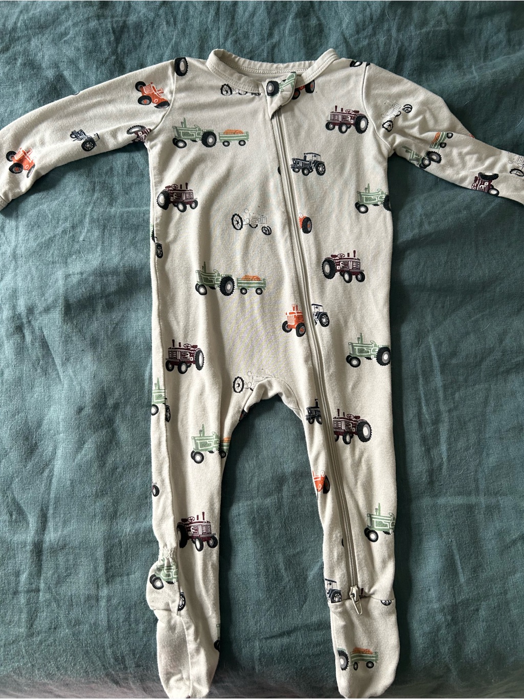Kyte Baby Cream Footed One-Piece With Tractor Print